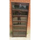 A vintage oak six section Globe-Wernicke style stacking bookcase, with glazed rising doors, on