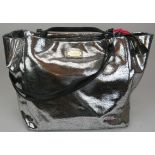 A large Paul Costelloe handbag with silver crackle metallic decoration and added shoulder strap,
