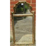 A Continental wall mirror, within a double giltwood surround enclosing sectioned glass with an