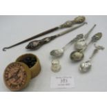 Two silver handled button hooks with original box of boot buttons, a thimble and four various silver