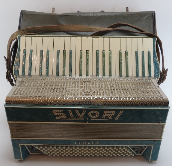 An Italian Sivori piano accordion. Modelled with one hundred and twenty buttons and 41 keys.
