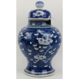A large Chinese blue and white vase and cover, 19th century. Of baluster form, the exterior