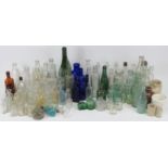 A large collection of vintage and antique pharmaceutical and drinks bottles. (Quantity). Condition