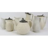 A group of Victorian salt glazed relief moulded stoneware items. Comprising a teapot and six