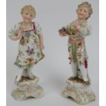 A pair of German Triebner, Ens & Co porcelain figurines of a boy and girl, circa/post 1900. Blue