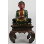 A Chinese gilt lacquered carving of Buddha with stand, 20th century. 51 cm total height. Condition