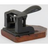 A vintage cast iron and wood hole punch, late 19th/early 20th century. 15.5 cm length. Condition