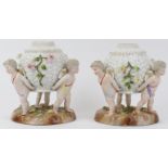 A pair of German Dresden porcelain oil lamp stands. Both modelled depicting three equidistant