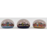 A group of three millefiori glass spoke paperweights, attributed to Paul Ysart. Each paperweight