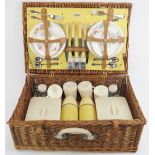 A English vintage Sirram picnic hamper set. Comprising flasks, containers, plates and cutlery housed