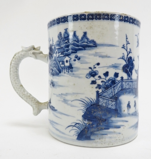 A Chinese export blue and white porcelain tankard, late 18th century. With a dragon moulded