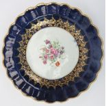 An early Worcester gilt and polychrome enamel decorated porcelain plate, late 18th century. George