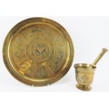 Two Middle Eastern engraved and inlaid brass wares, 20th century. Comprising a circular tray with