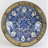 A large Western Moroccan Safi blue and white ceramic wall charger, 20th century. With metal mounts