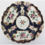 An early Worcester gilt and polychrome enamel decorated porcelain plate, 18th century. George III