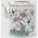 A Chinese famille rose enamelled teapot, 19th century. Finely overglaze enamel painted depicting