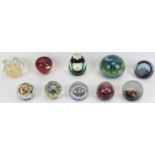 A collection of British and European glass paperweights, 20th century. Notable makers include