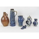 A group of German stoneware ceramic items. Comprising a stoneware salt glazed jug, 17th century,