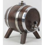 A small oak table-top whisky barrel drinks dispenser, mid 20th century. With white metal hoops,