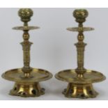 A pair of Victorian brass candlesticks, late 19th/early 20th century. Of a typical Dutch form with