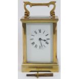 An English brass carriage clock by Huber, late 19th/early 20th century. With bevelled glass,