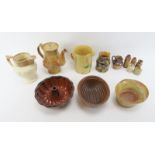 A group of ceramics including stoneware and slipware objects, 19th/early 20th century. Two jelly