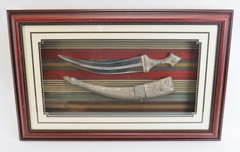 A Saudi Arabian silver and steel Jimbiya dagger, late 20th century. Framed and glazed. 42.5 cm