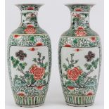 A pair of Chinese Famille verte porcelain vases, late Qing dynasty. Decorated with panels