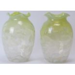A pair of late Victorian vaseline glass vases. Of ovoid form with frilly rims and decorated with