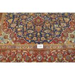 A fine central Persian Kashan carpet. central motif on blue ground and in excellent condition. 335 x