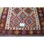 A Chobi Kilim rug. Good strong colours and in very good condition. 158cm x 109cm.