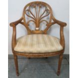 A vintage giltwood open-sided elbow chair in the Louis XV taste, the pierced back with scrolling