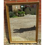 A rectangular bevelled wall mirror, in an antique style gilt gesso surround. H98cm W71cm D4cm (
