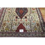 A Persian design rug, with central motif and highly decorated with stylised animals.