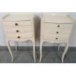 A near pair of vintage French bedside cabinets painted cream, each with ¾ gallery and housing