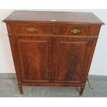 A good quality Edwardian flame mahogany side cabinet, housing two short drawers with fancy gilt