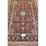 Central Persian Kashan rug floral pattern on red ground, in very clean condition. 195 x 132cm.