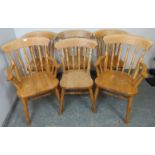 A set of six (4+2) light oak farmhouse kitchen chairs with spindle backs, on turned canted