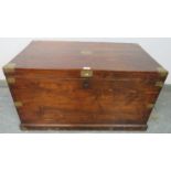 An antique stained pine flat-top trunk/blanket box with brass mounts and campaign style handle,