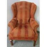 A good quality Georgian-style wingback armchair by Artistic Upholstery, upholstered in striped