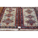 A fine pair of possibly Turkish Gharajeh rugs. The Gharajehs are handwoven Persian rugs made by