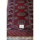 A mid 20th century Persian runner with repeat central motif on deep red ground in good condition.