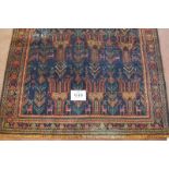 North East Persian Meshed Belouch rug. 15 repeat central motif on blue ground with wide borders