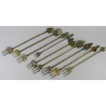 A group of nine brass and metal toasting forks, Victorian and later. (9 items) Longest fork: 51 cm