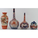 Four Japanese porcelain wares, Meiji period. Comprising an iron red Kutani ware vase, two Imari