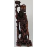 A large Chinese figural hardwood carving of Shou Lao the Chinese God of Longevity, 20th century.