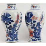 Two Chinese Imari decorated and gilt highlighted porcelain vases, 19th century. The matched pair