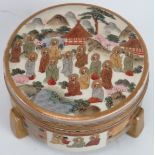 A Japanese satsuma box and cover, Meiji period. Of cylindrical form, supported on three feet and