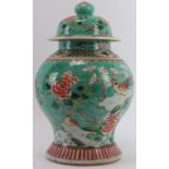 A Chinese famille verte porcelain jar and cover, early 20th century. Decorated with pheasants on