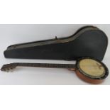 A vintage banjo with case. With wood, bone and ivorine sections. Banjo: 90 cm length. Condition